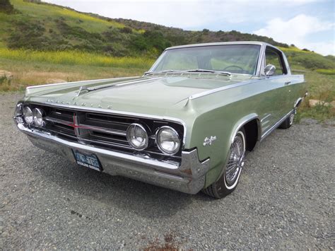 1964 Oldsmobile Starfire | Laguna Classic Cars & Automotive Art