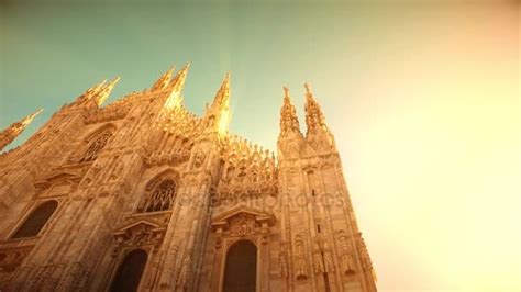 Sunset view of Milan Cathedral (Duomo di Milano) and piazza del Duomo in Milan (Italy) with ...