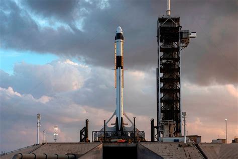 SpaceX stacks its internet satellites inside the Falcon 9 for upcoming ...