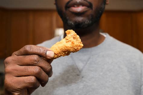 Black Man Eating Chicken Wings Stock Photos, Pictures & Royalty-Free ...