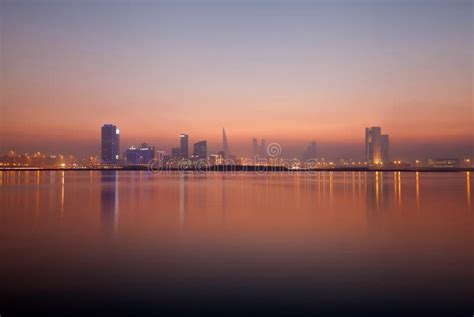 Bahrain skyline at sunset stock image. Image of coastline - 128152325