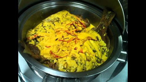 an omelet is being cooked in a pan on top of the burner