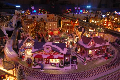 Our Yearly Christmas Village. Lionel train, trolley, 150 houses make up ...