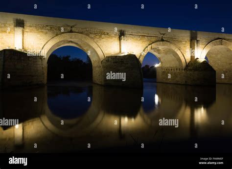 Ancient roman bridge over river in night Stock Photo - Alamy