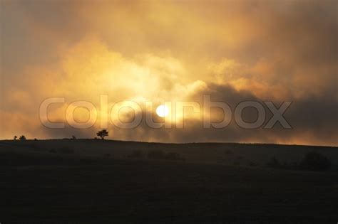 Overcast sunset above the summer ... | Stock image | Colourbox