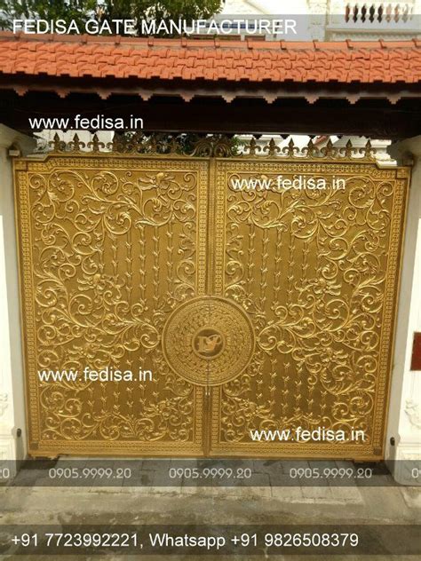 an ornate gold gate in front of a building