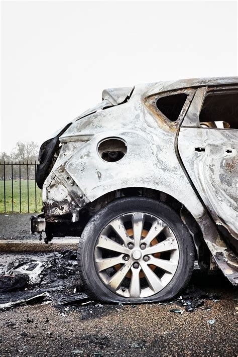 "Burnt Out Car" by Stocksy Contributor "James Ross" - Stocksy