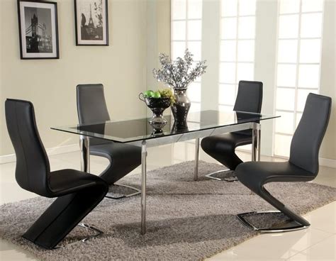 Black glass extendable dining set with four zig zag chairs. This ...