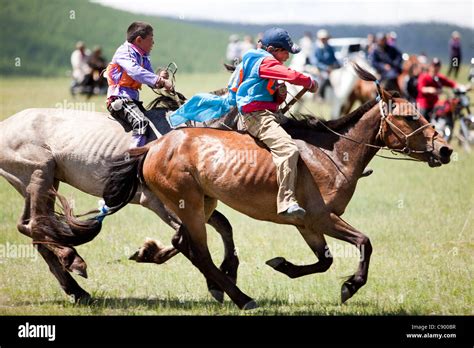 Mongolian child horse racing at Naadam festival in Tsagaannuur, Khövsgöl, Mongolia Stock Photo ...