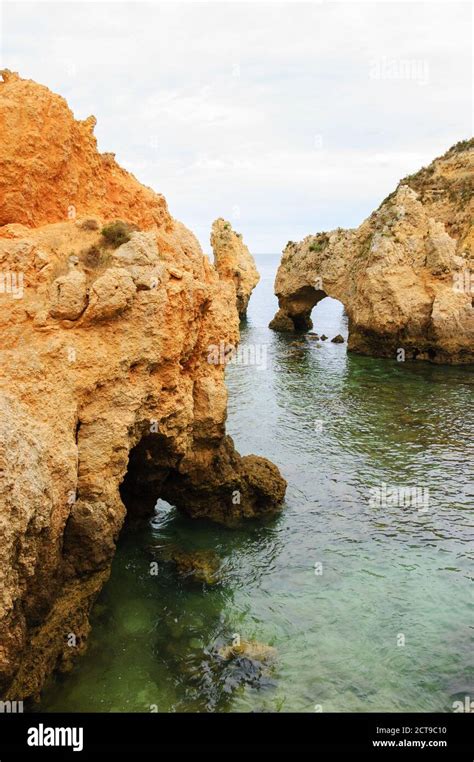 Unique stone arches, caves, rock formations at Dona Ana Beach (Lagos, Algarve coast, Portugal ...