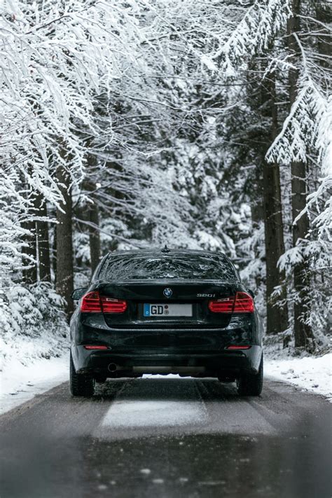 Black car on snow covered road photo – Free Automobile Image on Unsplash