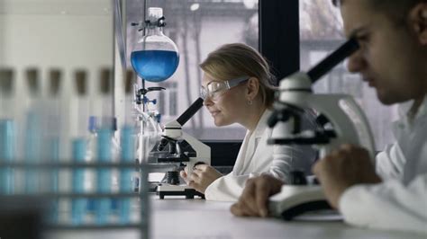 Female researcher conducting an experiment in lab Stock Video Footage - Storyblocks