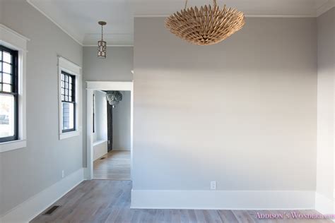 living-room-light-gray-walls-grey-gold-chandelier-black-window-sashes-whitewashed-hardwood ...