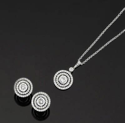 A pair of diamond earrings and a pendant necklace | Christie's