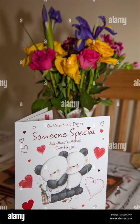 A Valentines day card and flowers Stock Photo - Alamy