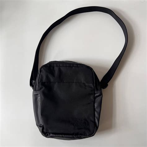 The North Face sling bag- black on Carousell