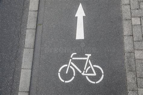 Bike Lane Ahead Sign with Arrow Painted on Asphalt Street Stock Photo - Image of sprayed, town ...