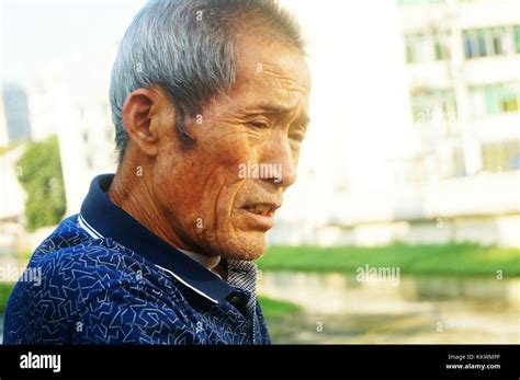 An 80-year-old Chinese man, playing outdoors Stock Photo - Alamy