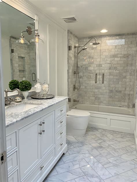 Full Bathroom Renovation with Marble Herringbone Floor and Double Swing ...