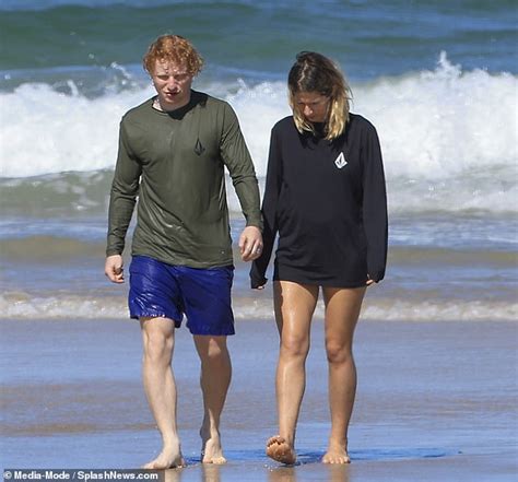 Ed Sheeran looks every inch the doting father as during beach day with ...