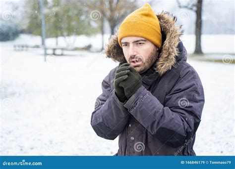 Man Wearing Warm Clothes Freezing in the Snow Stock Image - Image of influenza, frozen: 166846179