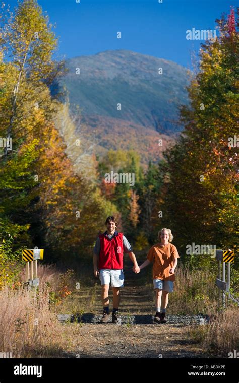 Walking a rail trail in Jefferson NH Mount Madison is in the distance White Mountains Stock ...