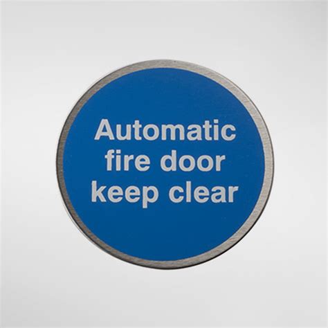 98947 Alite Circular Self Adhesive ‘Automatic Fire Door Keep Clear’ Sign