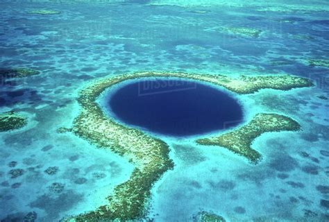 Aerial view of Blue Hole, Lighthouse Reef, Belize, Central America. - Stock Photo - Dissolve