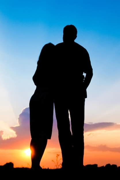 Premium Photo | Happy couple together at sunset silhouette of nature