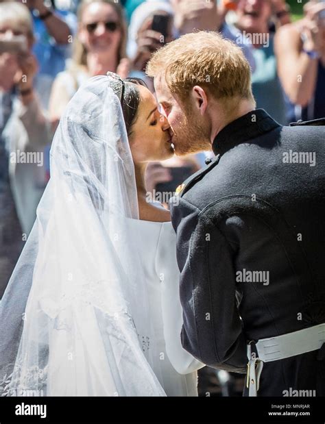 Meghan Markle and Prince Harry kiss on the steps of St George's Chapel ...