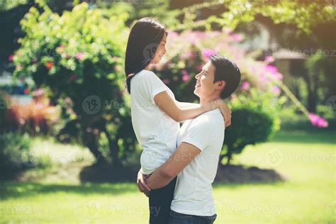 Young couple hugging and relaxing together 2005370 Stock Photo at Vecteezy