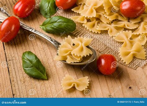 Raw farfalle bow-tie pasta stock photo. Image of pasta - 86015172