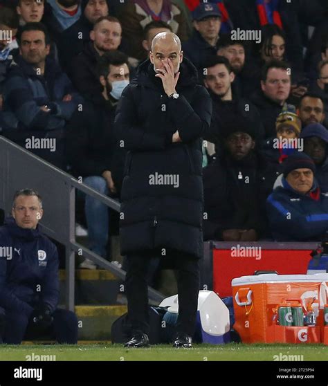 Josep Guardiola Manager of Manchester City looks dejected against ...