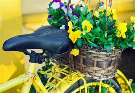 Premium Photo | Yellow bicycle decorated with flowers