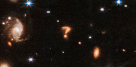 Mysterious galaxy resembling a giant ‘question mark’ discovered by Webb ...