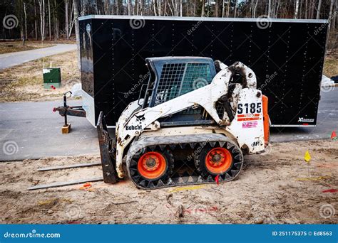 CROW WING CO, MN - 5 MAY 2022: Bobcat with Forklift and Black Trailer Editorial Image - Image of ...