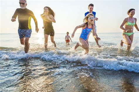 Download premium image of Family playing at the beach 424336 | Family images, Beach photos, Beach