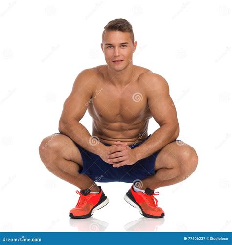 Crouching Fit Man Posing stock image. Image of muscle - 77406237