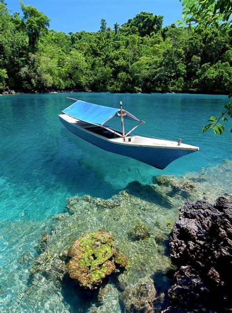 The beautiful clear waters of Ternate Island Indonesia - Photorator