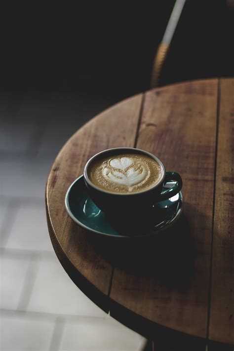 Round Teal and White Ceramic Mug With Saucer Set With Coffee Inside · Free Stock Photo