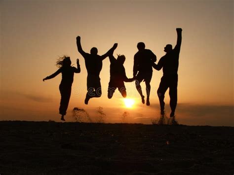 Sunset Friends Jumping Stock Images - Image: 14260694