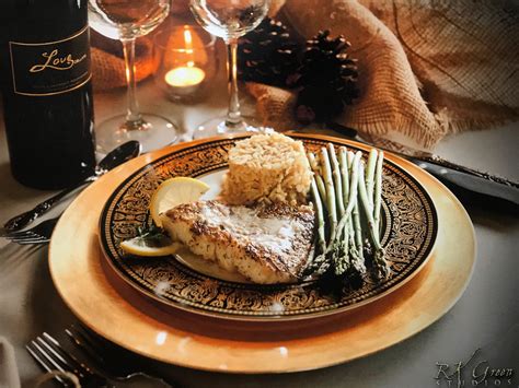 Formal, plated dinner This elegant meal includes salmon, wild rice, and roasted asparagus ...