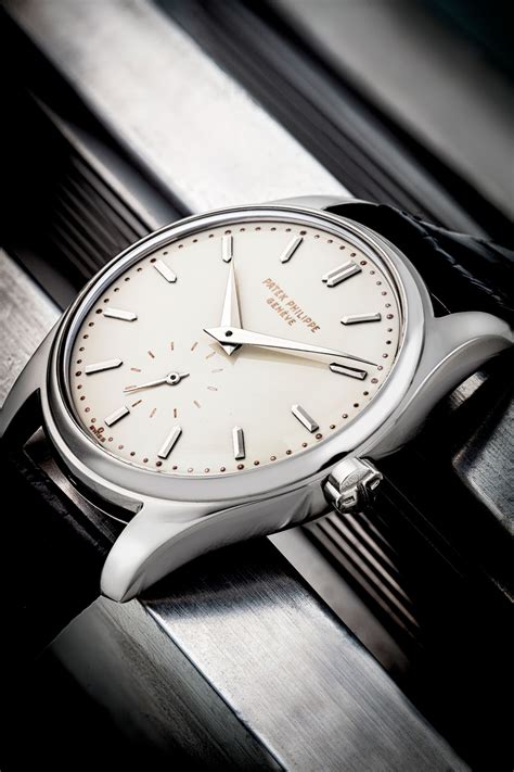 PATEK PHILIPPE. AN EXTREMELY RARE AND HIGHLY ATTRACTIVE 18K WHITE GOLD AUTOMATIC WRISTWATCH WITH ...