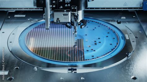 Semiconductor Packaging Process. Computer Chips are being Extracted by a Pick and Place Machine ...