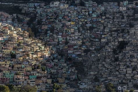 Eking out a living in Haiti's colourful slum city - BBC News