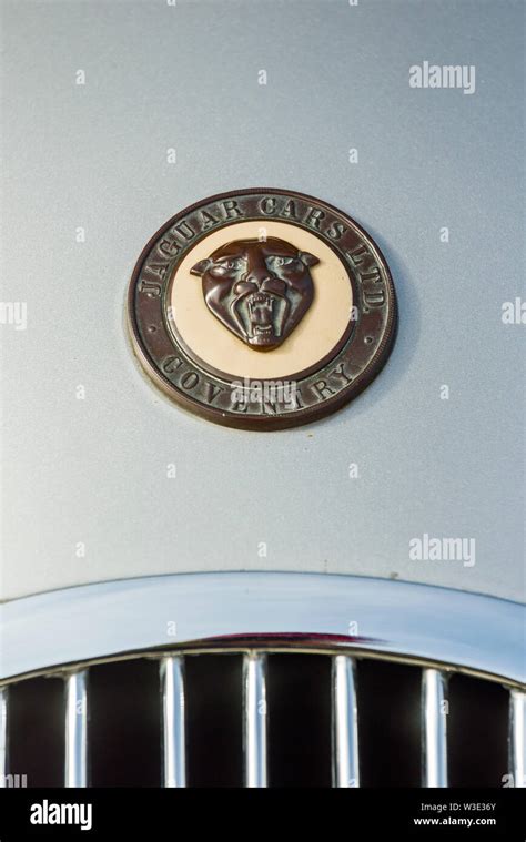 Jaguar Coventry car emblem in a demonstration in honor of old model of the Jaguar brand on the ...