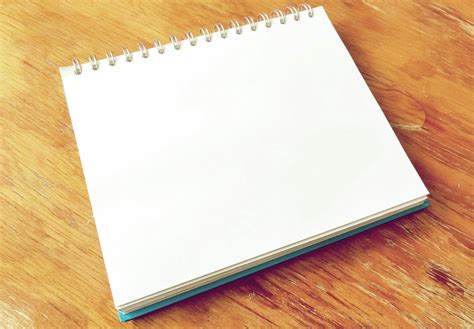 White Notepad on Brown Surface · Free Stock Photo