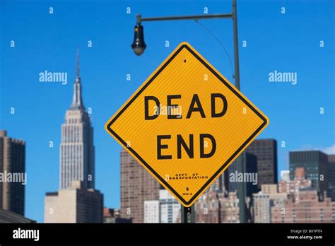 Cityscape with Dead End road sign Stock Photo - Alamy