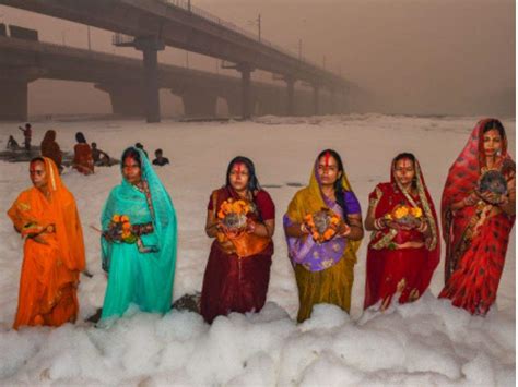 In photos: On Chhath Puja, devotees throng Yamuna river despite deadly ...