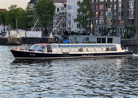 Amsterdam: Canal Cruise with Live Commentary and Audio Guide | GetYourGuide